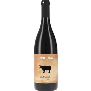 750ml bottle of Meinklang Blaufrankisch red wine with a black glass body, black cap, and a beige label featuring a black cow silhouette.